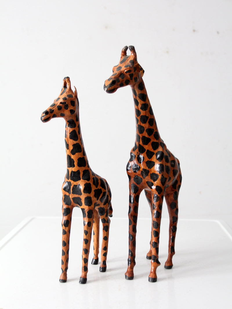 mid-century leather giraffes pair