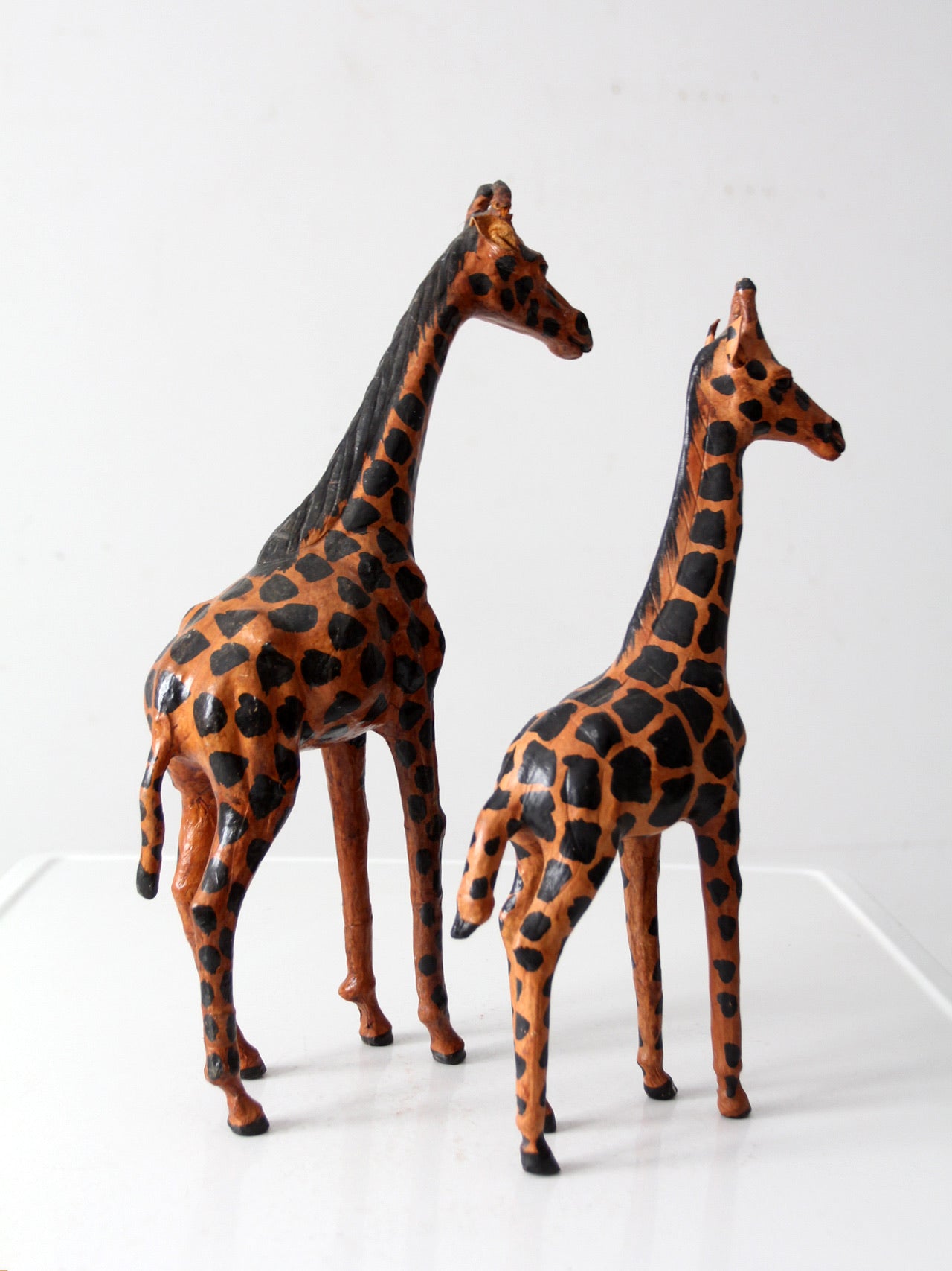 mid-century leather giraffes pair