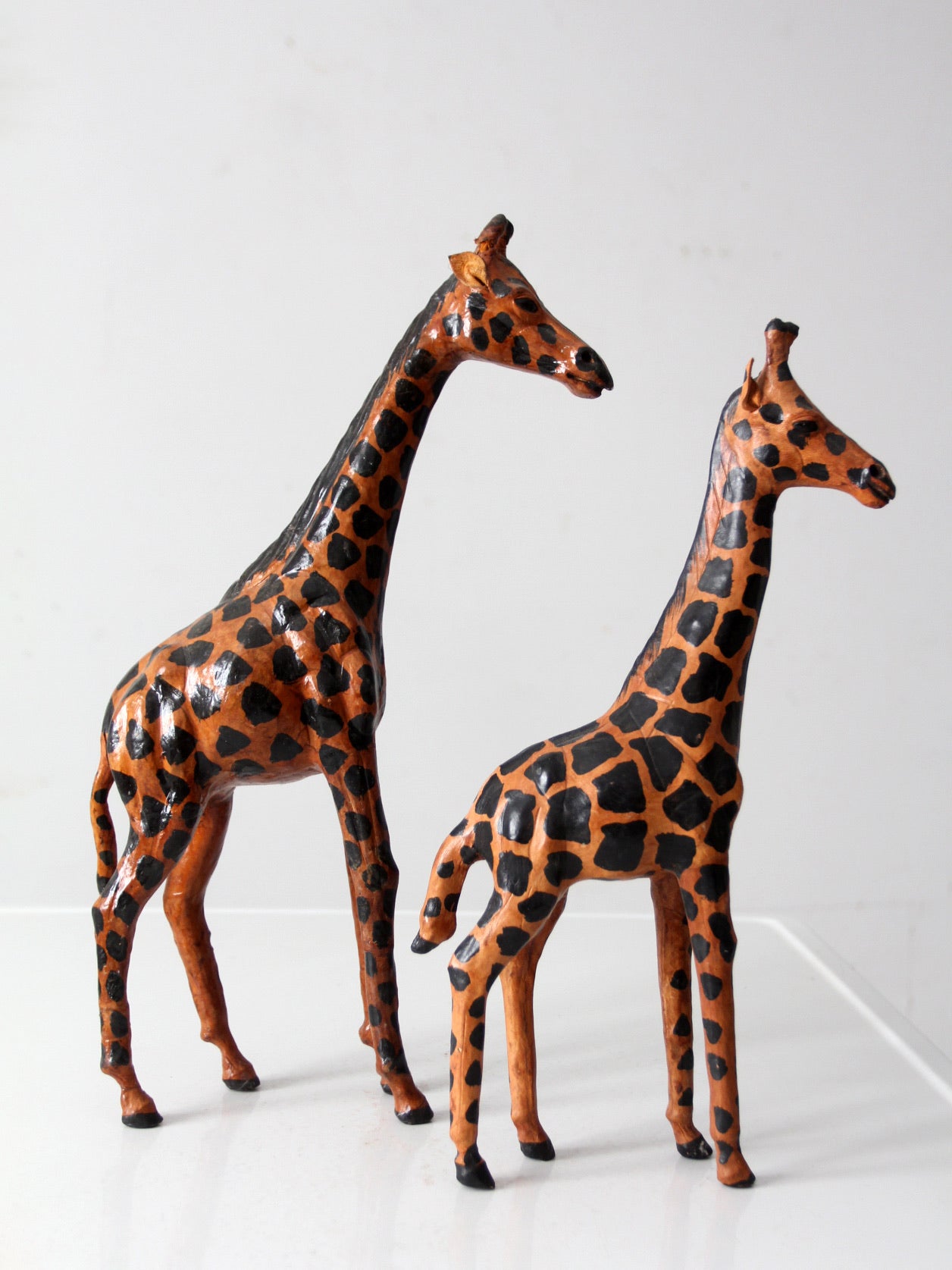 mid-century leather giraffes pair