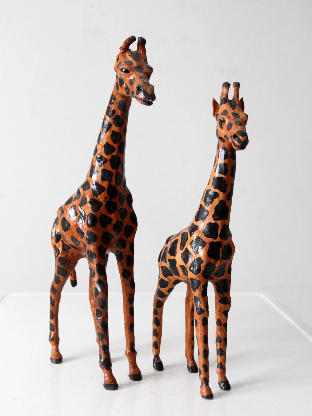 mid-century leather giraffes pair