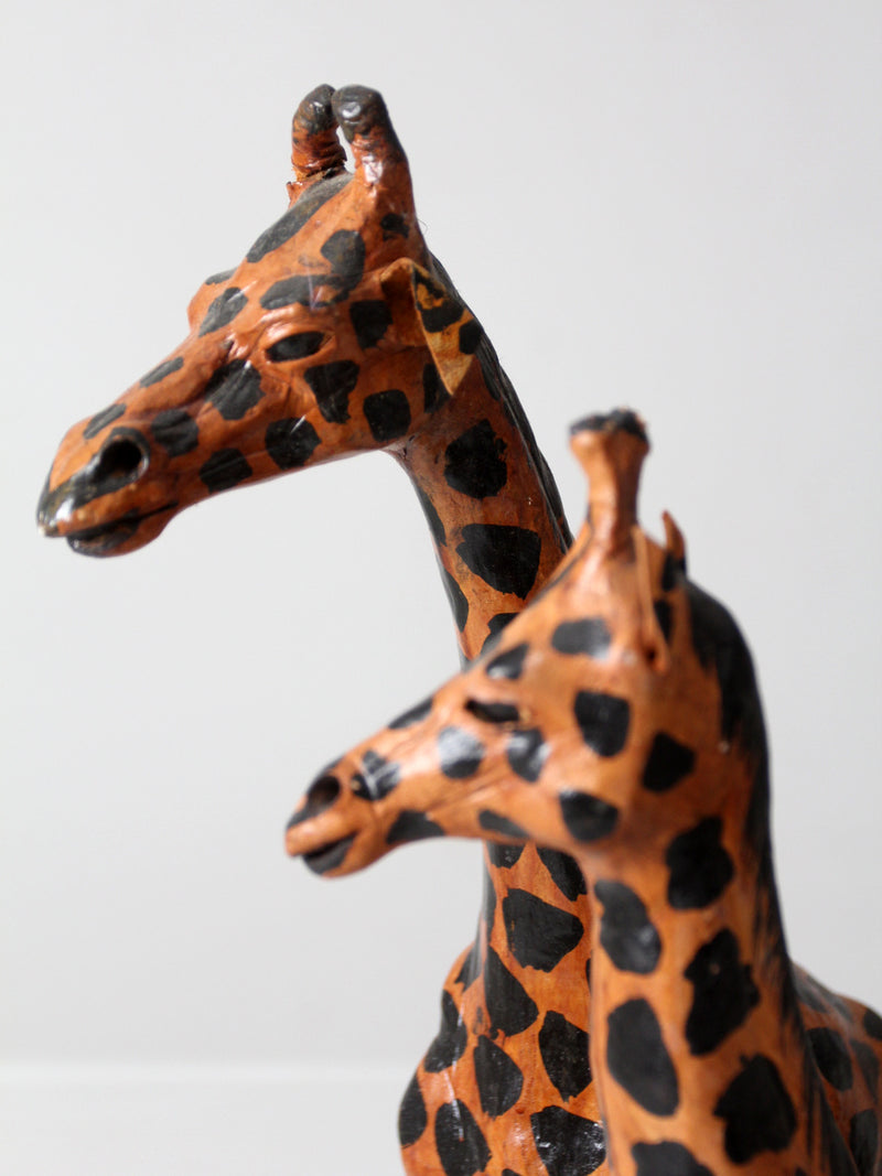 mid-century leather giraffes pair