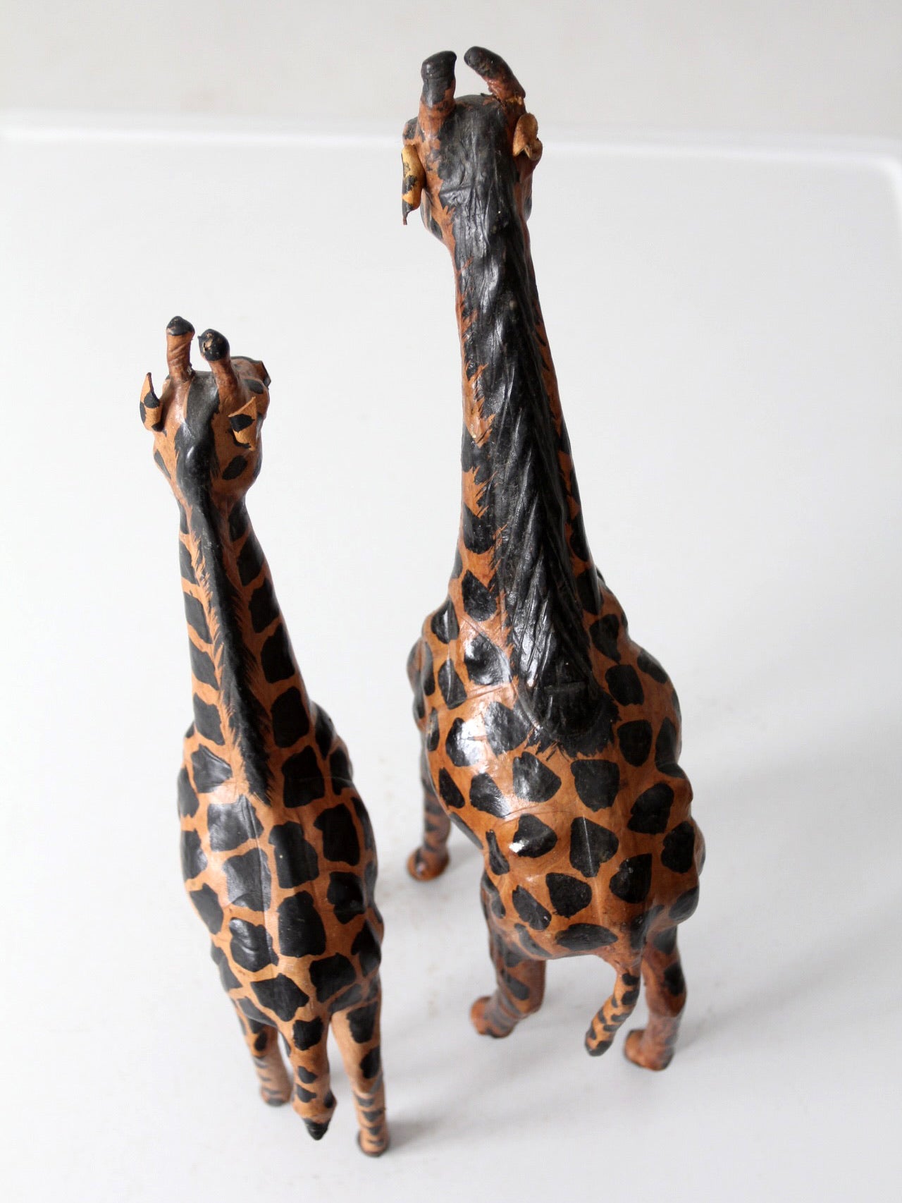 mid-century leather giraffes pair