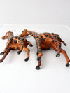mid-century leather giraffes pair