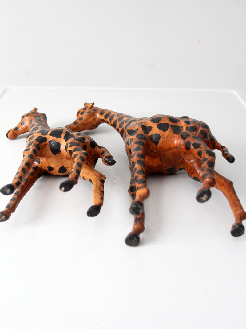 mid-century leather giraffes pair