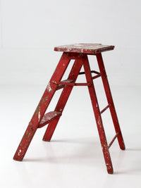 vintage red wooden step ladder