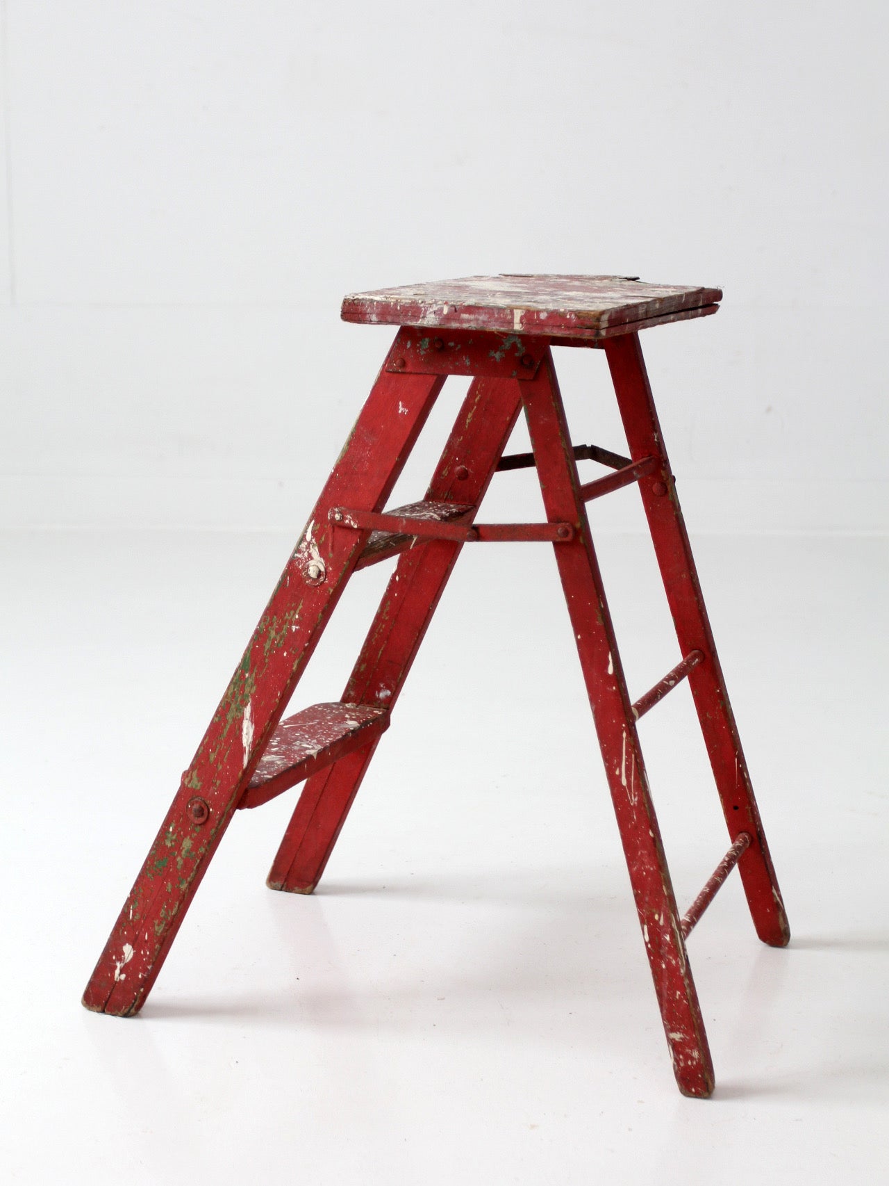 vintage red wooden step ladder