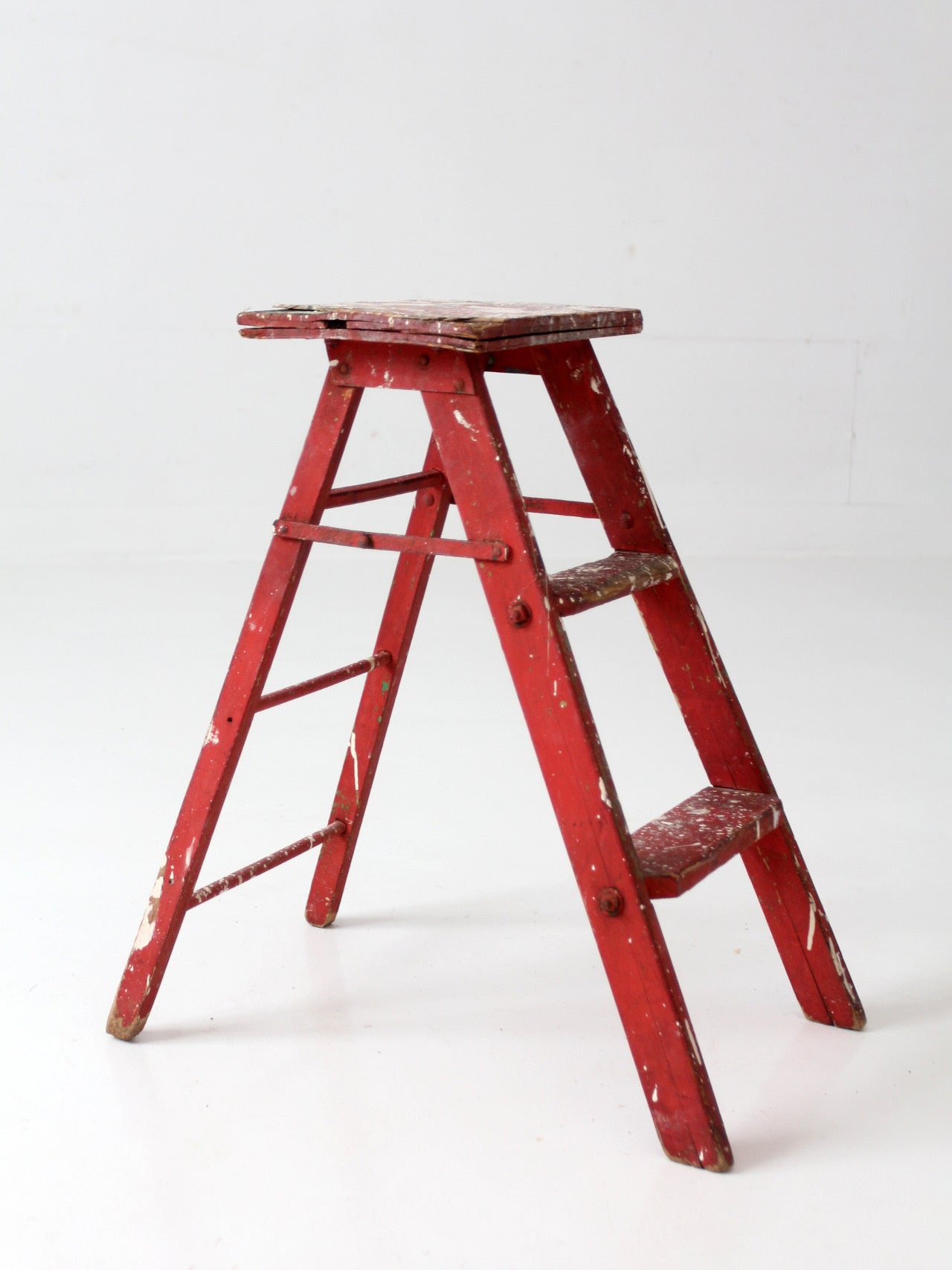 vintage red wooden step ladder