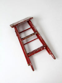 vintage red wooden step ladder