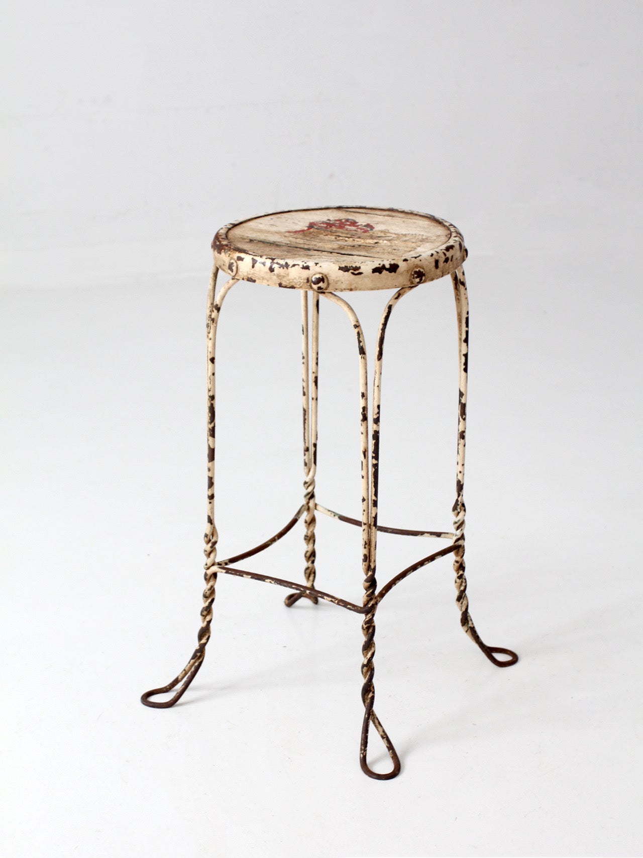 vintage twisted metal garden stool with wood top