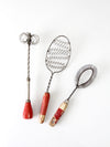 vintage red-handled whisk collection