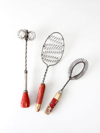 vintage red-handled whisk collection
