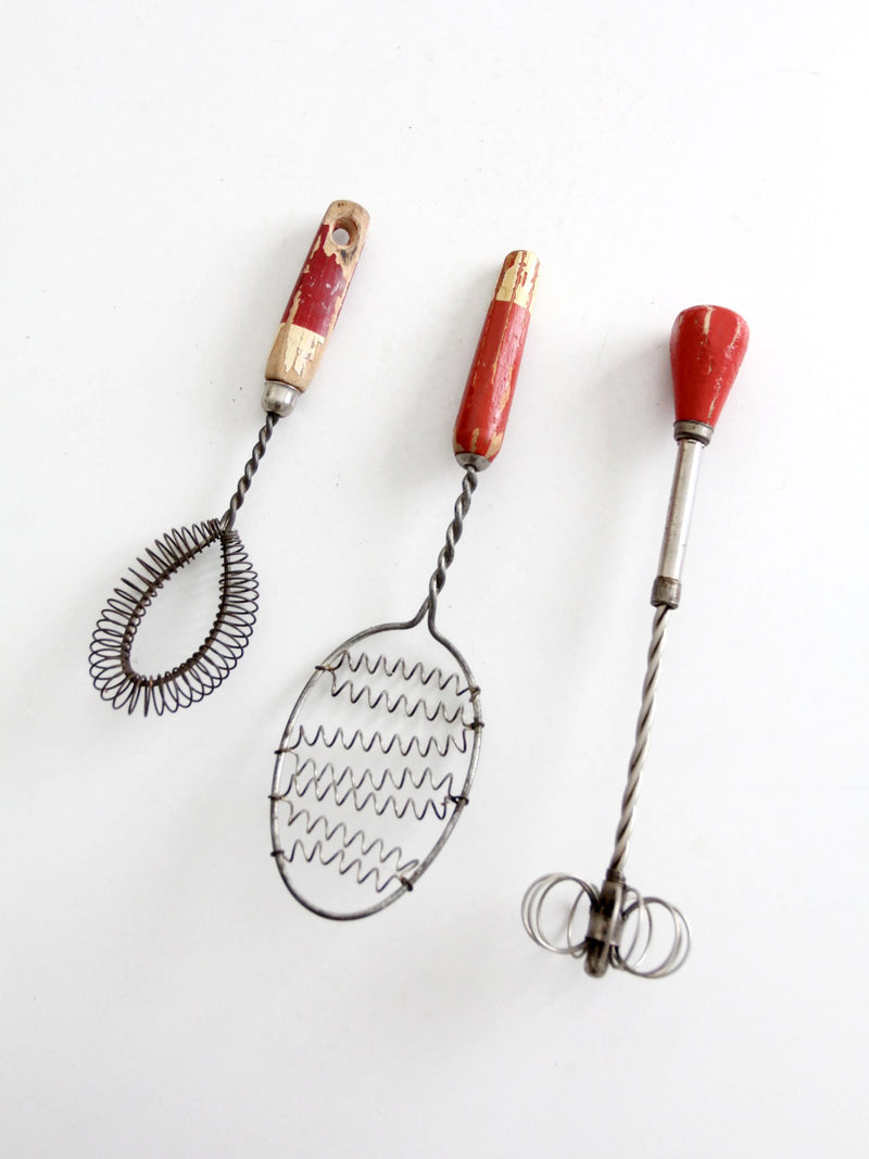 vintage red-handled whisk collection