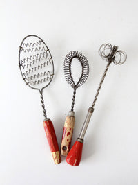 vintage red-handled whisk collection