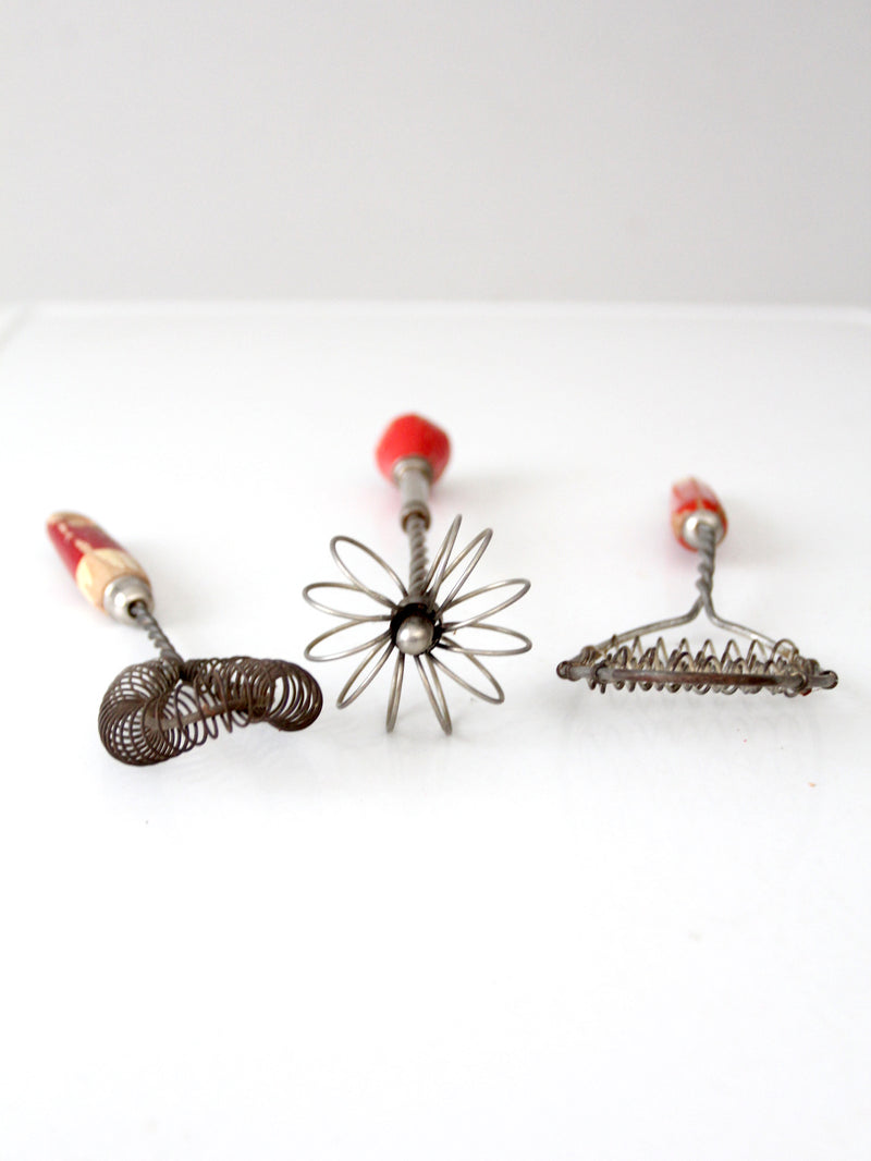 vintage red-handled whisk collection