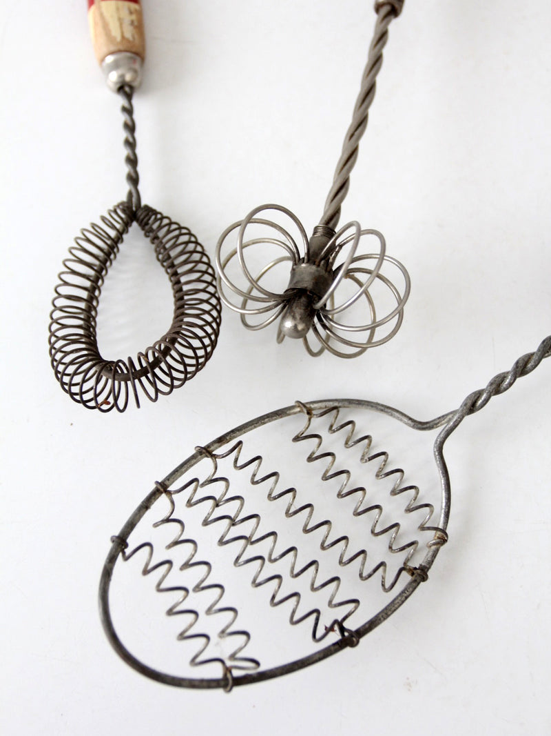 vintage red-handled whisk collection