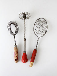 vintage red-handled whisk collection