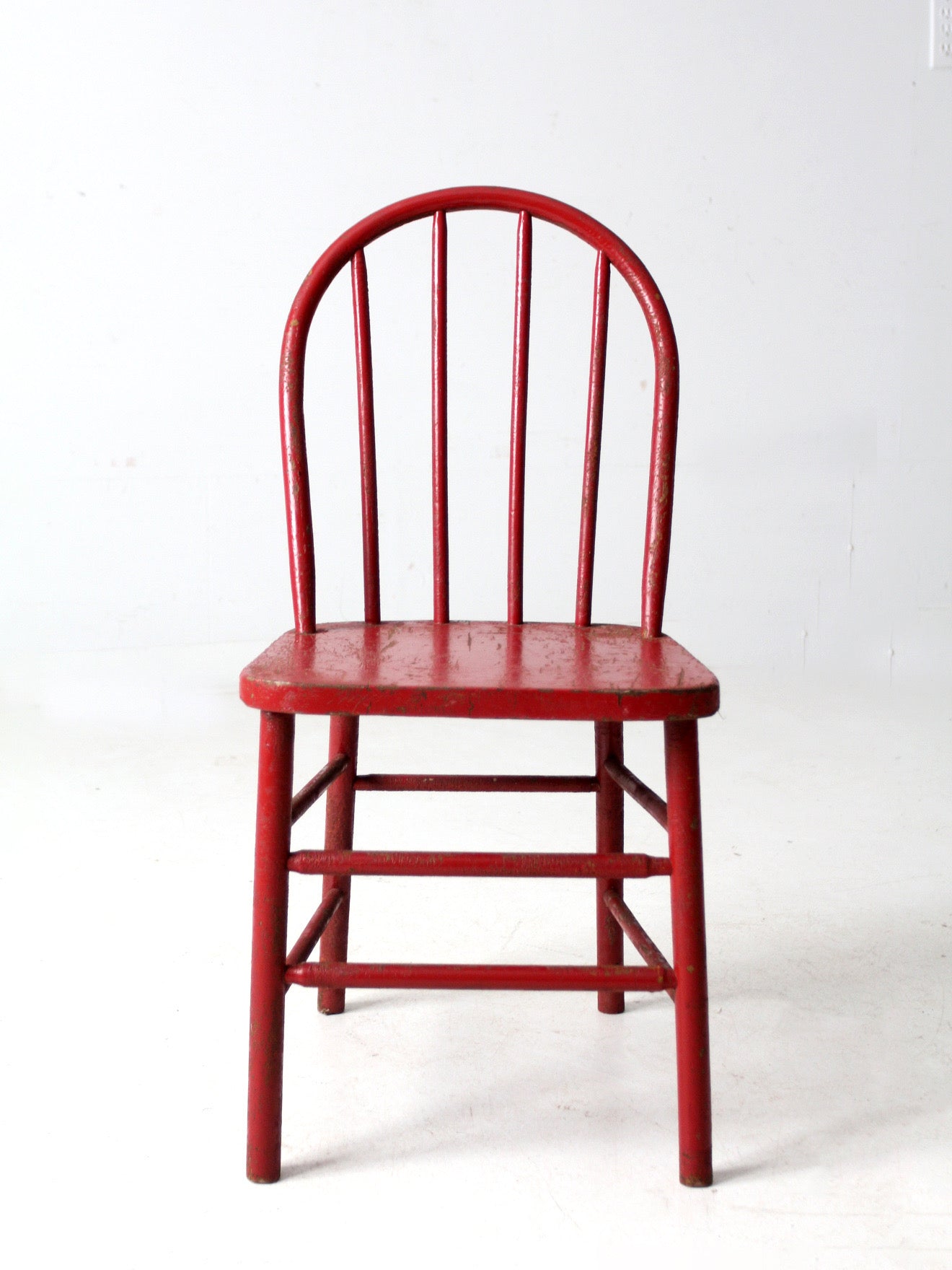 early 20th century red spindle back chair