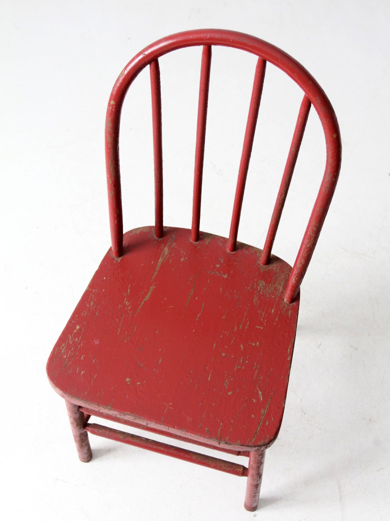 early 20th century red spindle back chair