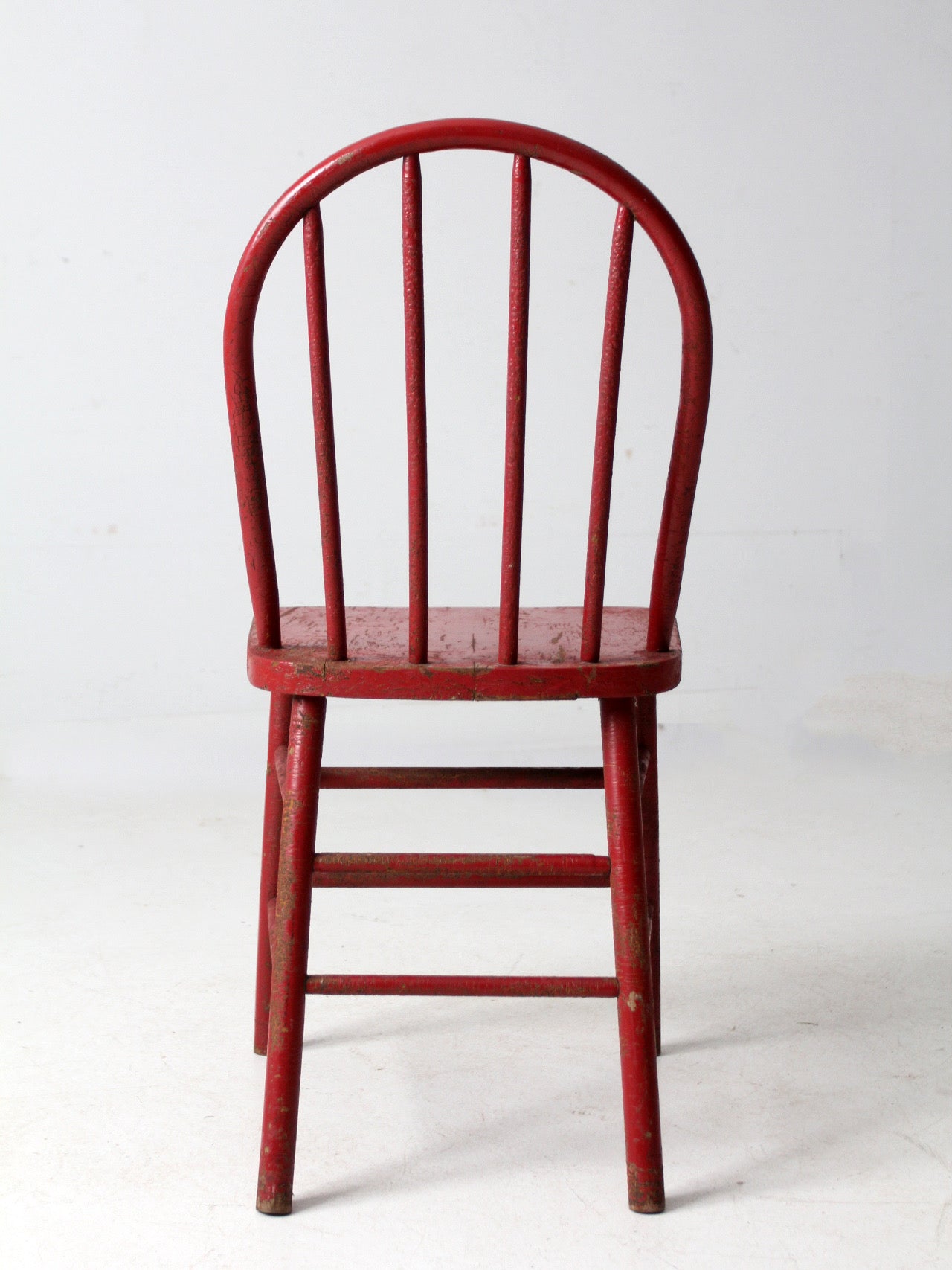 early 20th century red spindle back chair