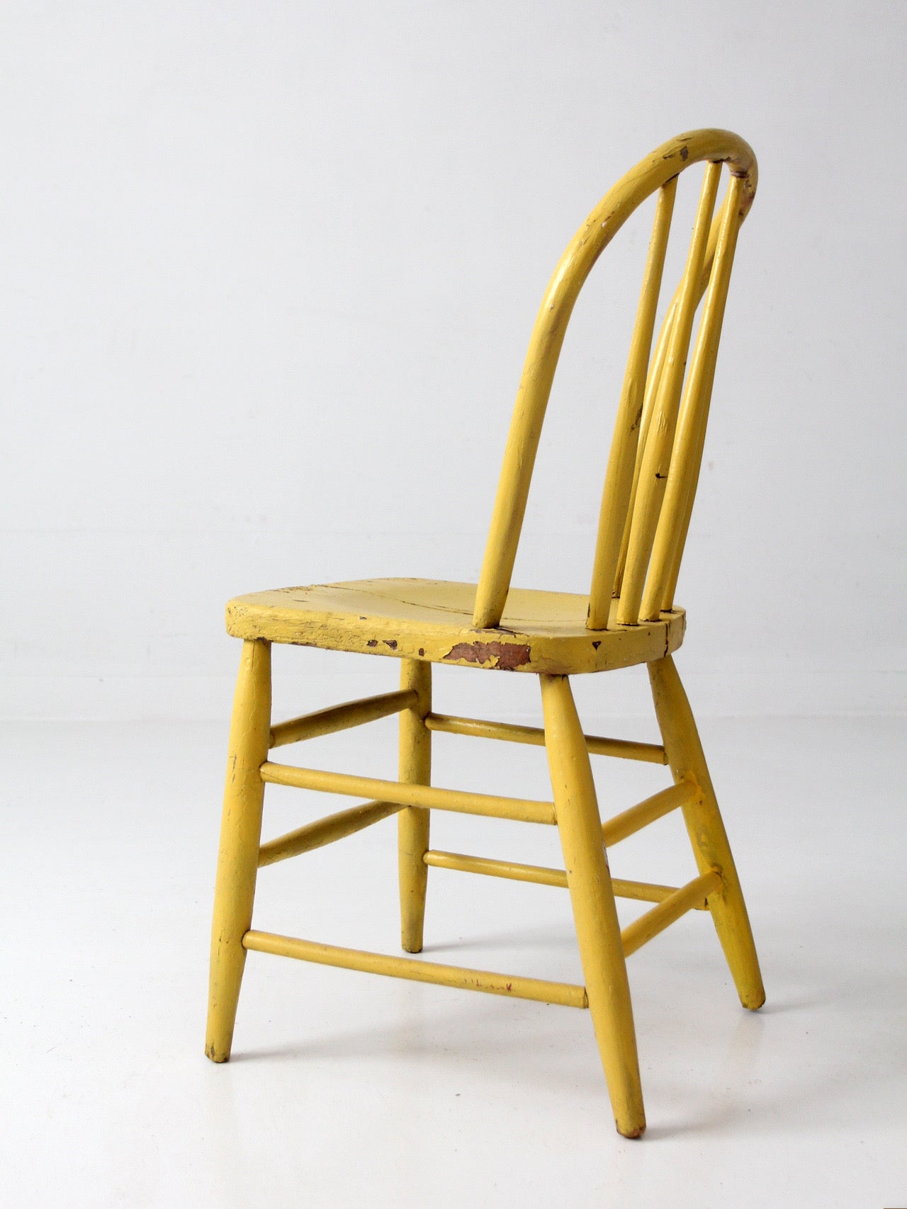 antique yellow painted Windsor spindle back chair