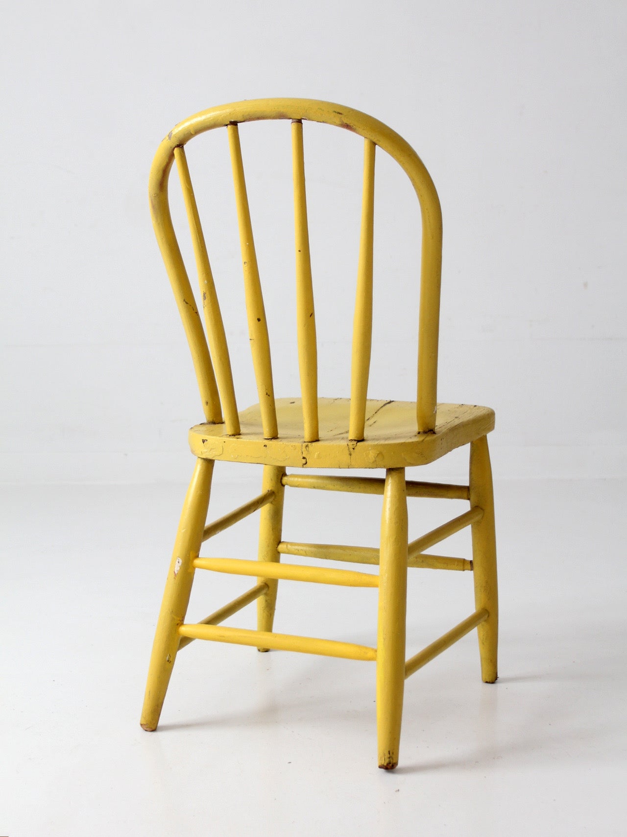 antique yellow painted Windsor spindle back chair