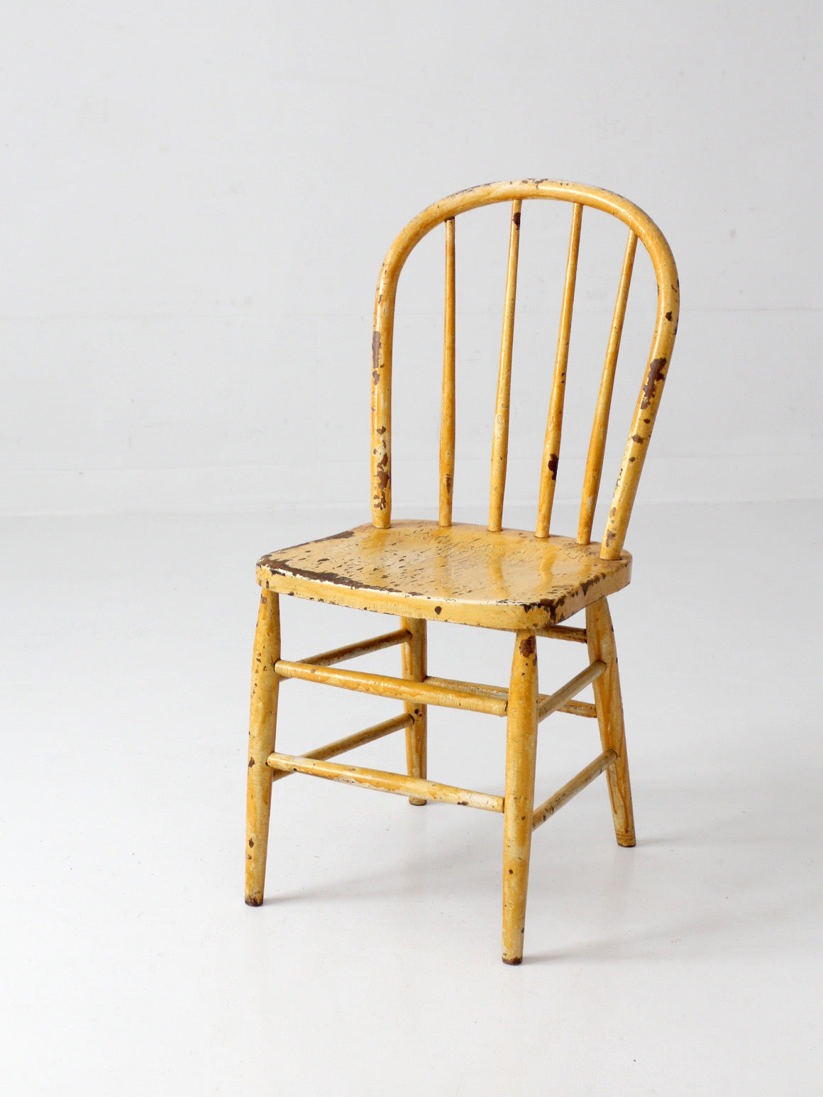 antique yellow painted Windsor style chair