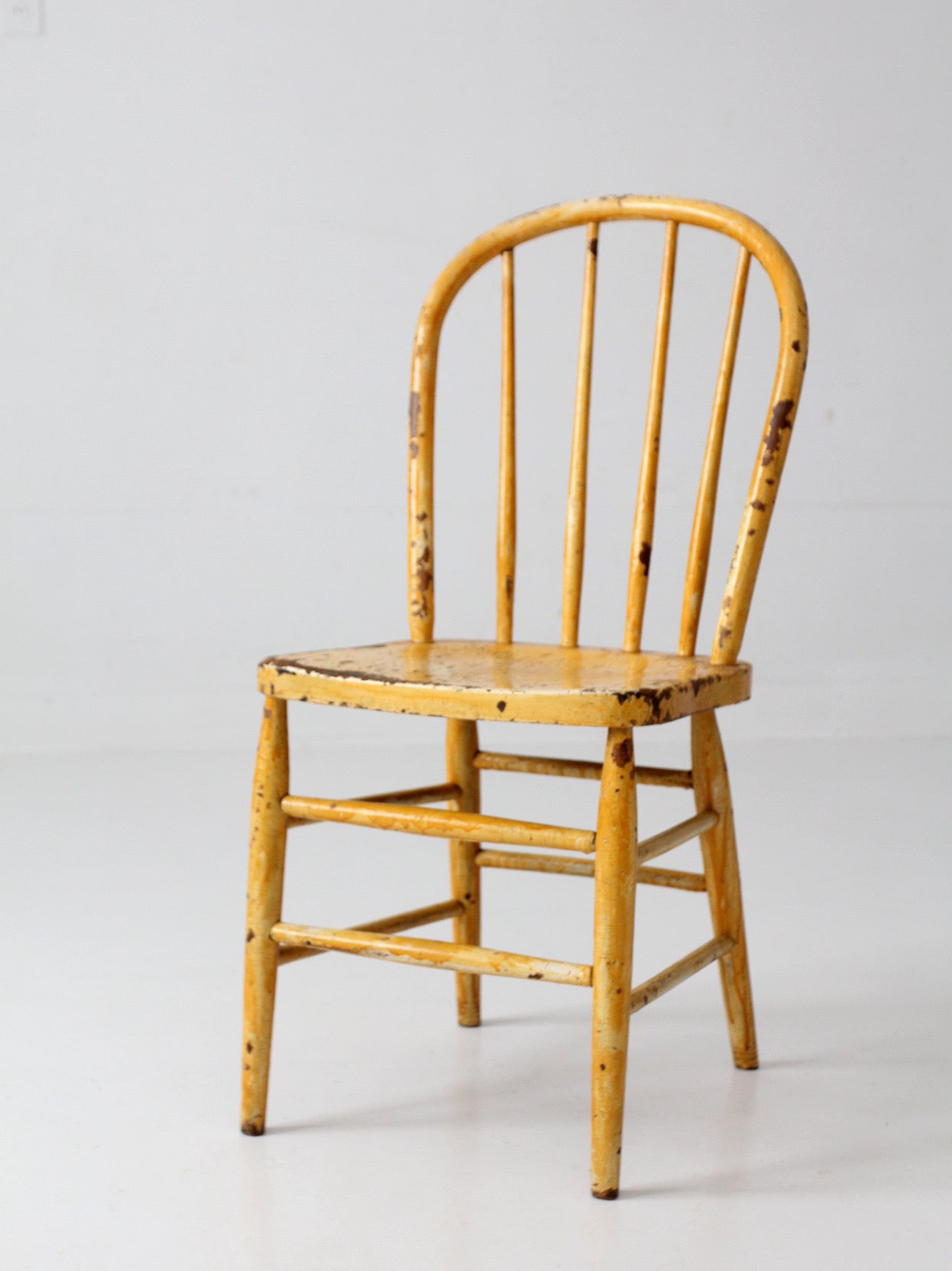 antique yellow painted Windsor style chair