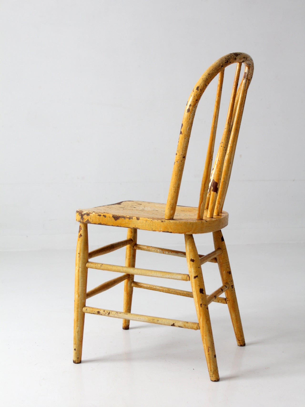 antique yellow painted Windsor style chair