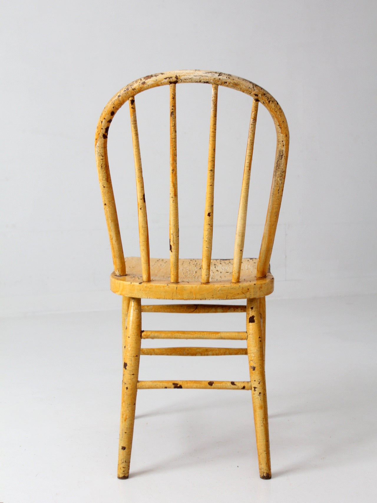 antique yellow painted Windsor style chair