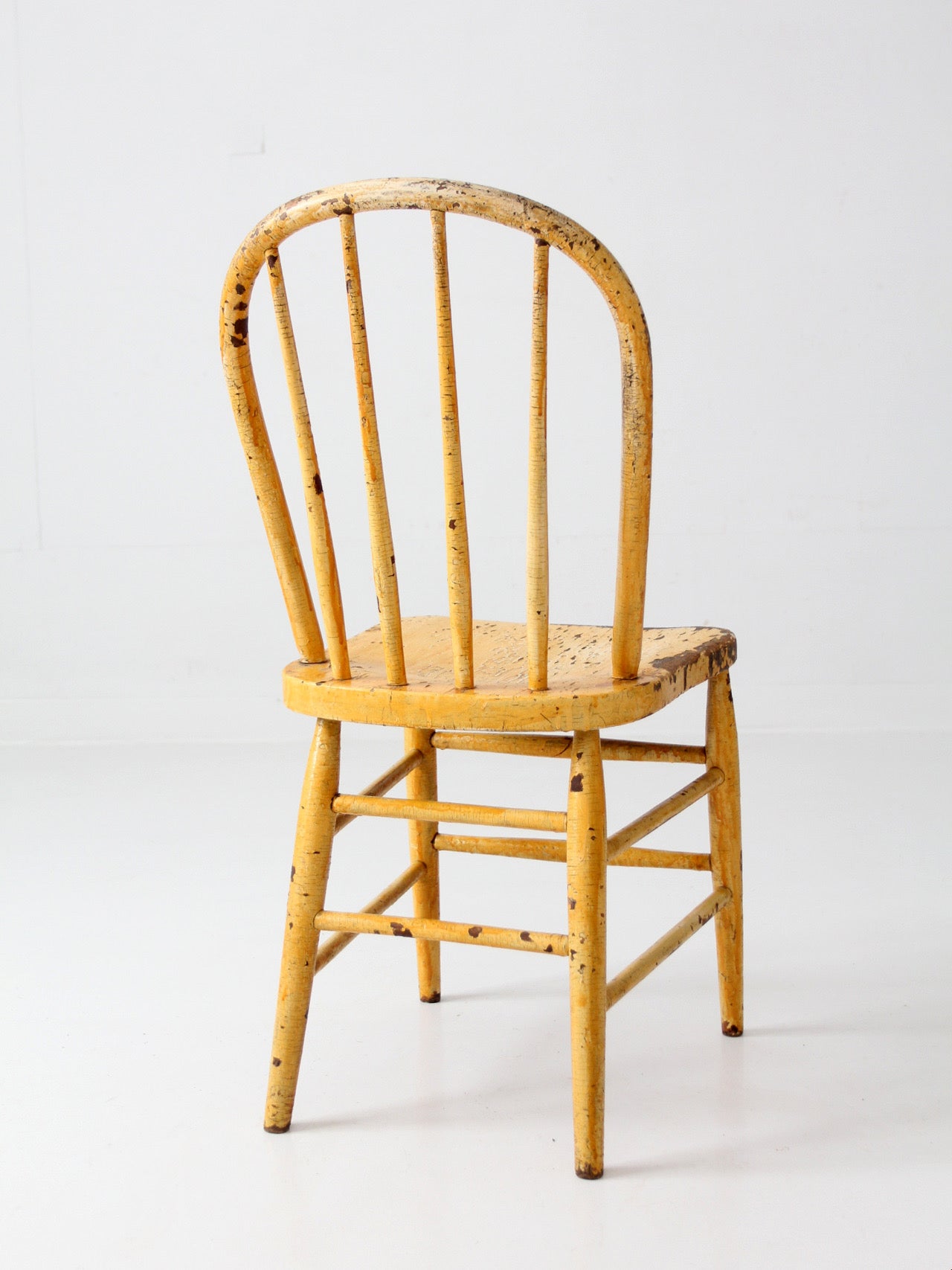 antique yellow painted Windsor style chair