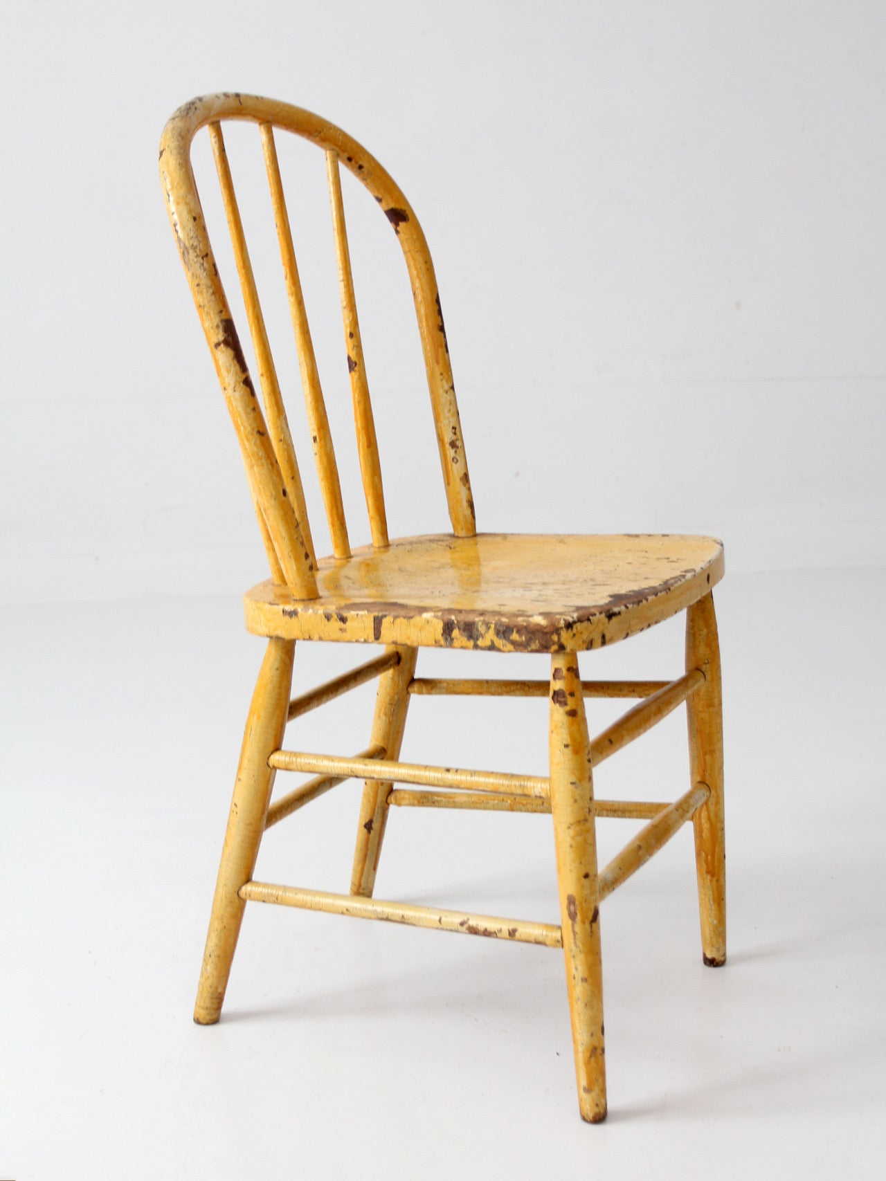 antique yellow painted Windsor style chair