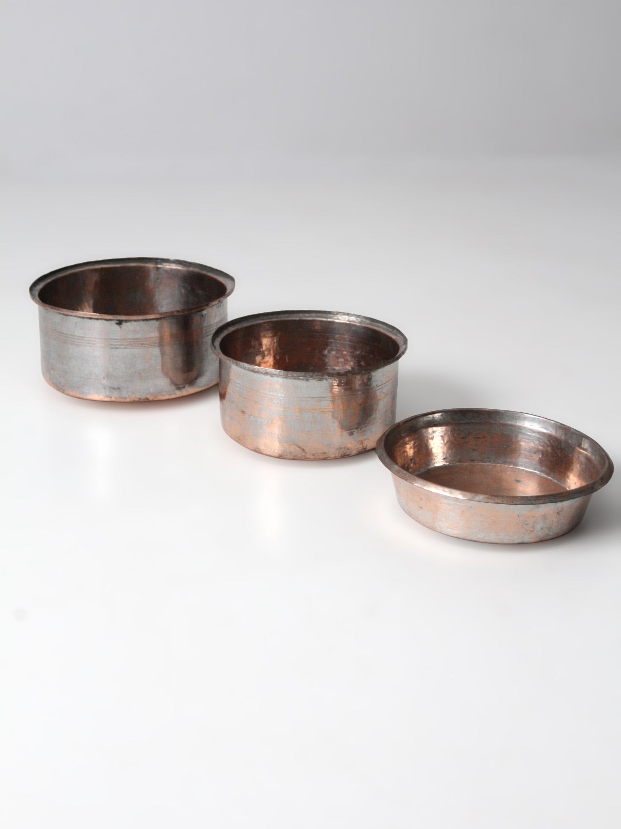 set of 3 antique hand-hammered copper bowls