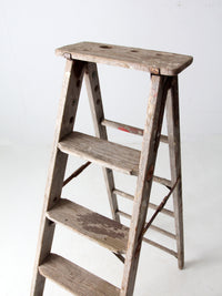 vintage wooden ladder with metal braces