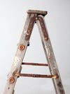 vintage wooden ladder with metal braces