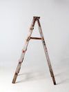 vintage wooden ladder with metal braces