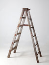 vintage wooden ladder with metal braces