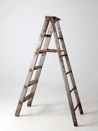 vintage wooden ladder with metal braces