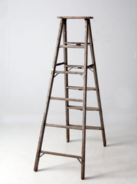 vintage wooden ladder with metal braces