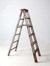 vintage wooden ladder with metal braces