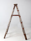 vintage wooden ladder with metal braces