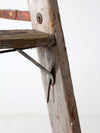 vintage wooden ladder with metal braces
