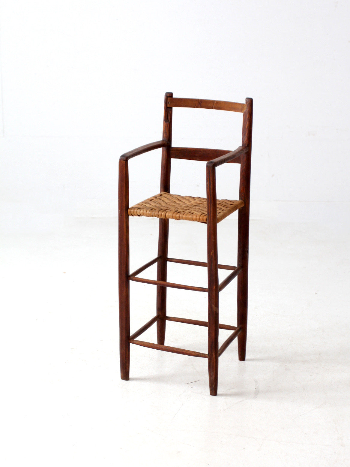 antique child's woven seat high chair