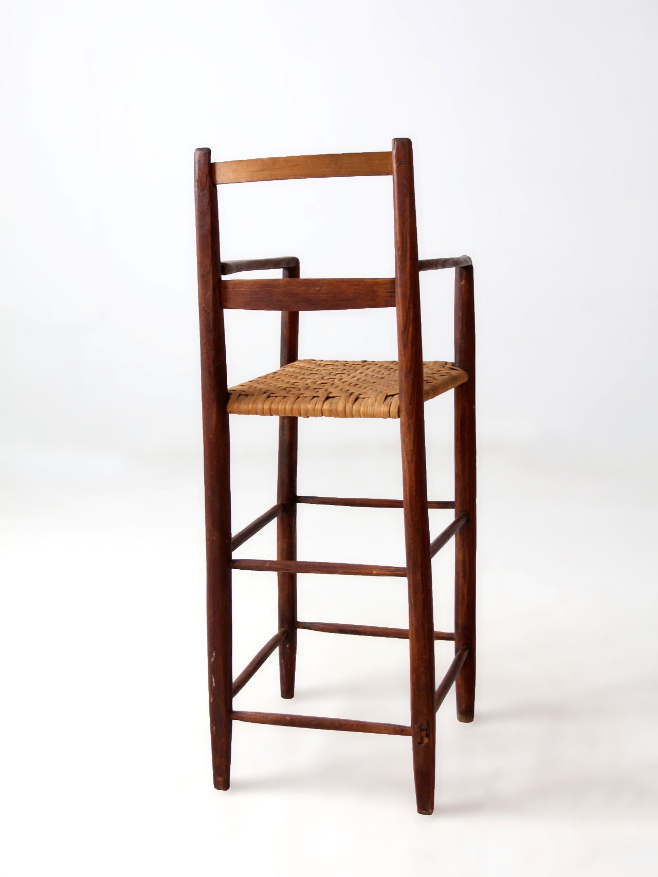 antique child's woven seat high chair