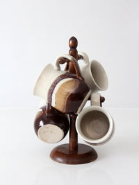 set of vintage handmade studio pottery mugs with wooden stand