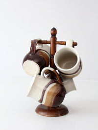 set of vintage handmade studio pottery mugs with wooden stand