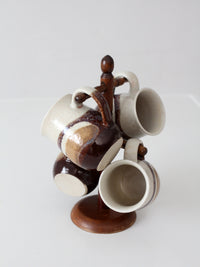 set of vintage handmade studio pottery mugs with wooden stand