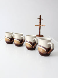 set of vintage handmade studio pottery mugs with wooden stand