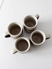 set of vintage handmade studio pottery mugs with wooden stand
