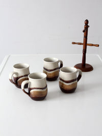 set of vintage handmade studio pottery mugs with wooden stand