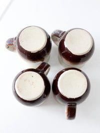 set of vintage handmade studio pottery mugs with wooden stand